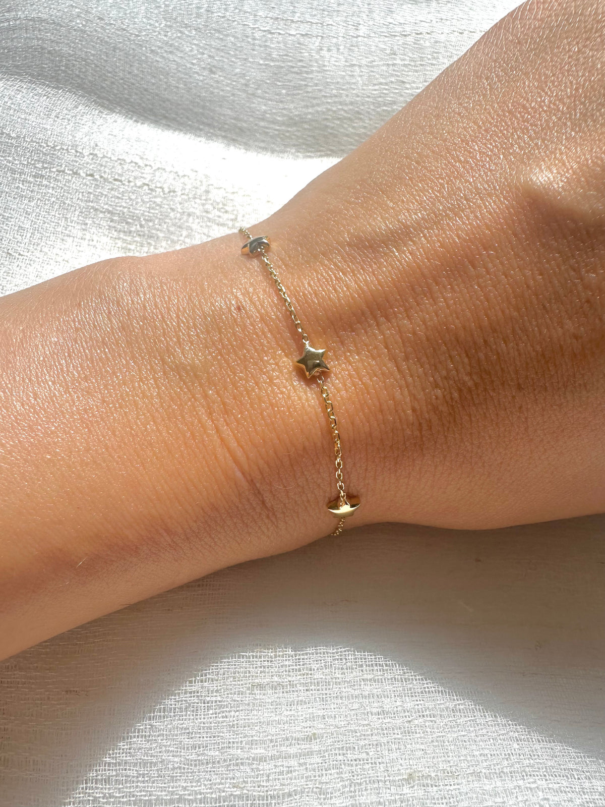 18K gold stars bracelet with five puffy star charms | Yasmin Nabulsi Fine Jewelry