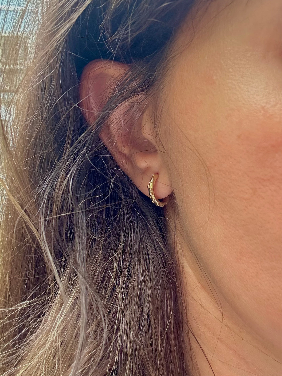 Solid gold hoop earrings with a push back closure, 11mm, in 14K or 18K