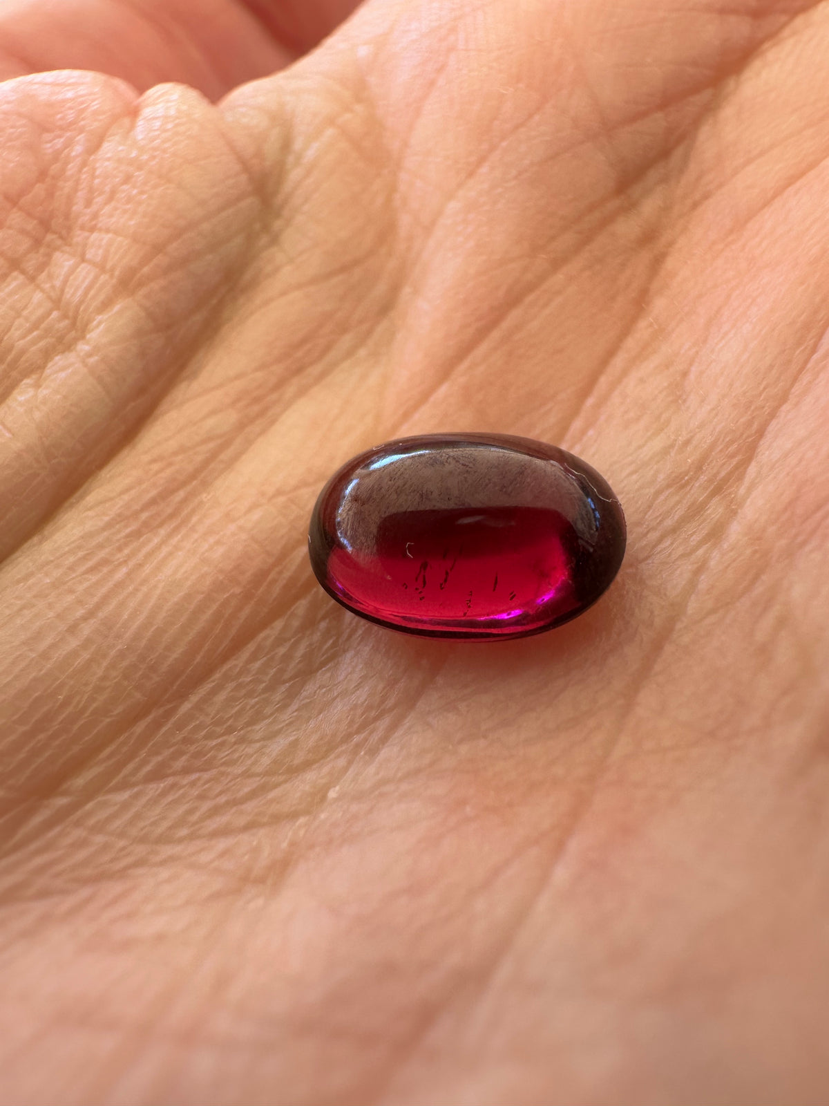 Oval garnet cabochon, a 3.38 carat gemstone for a custom design