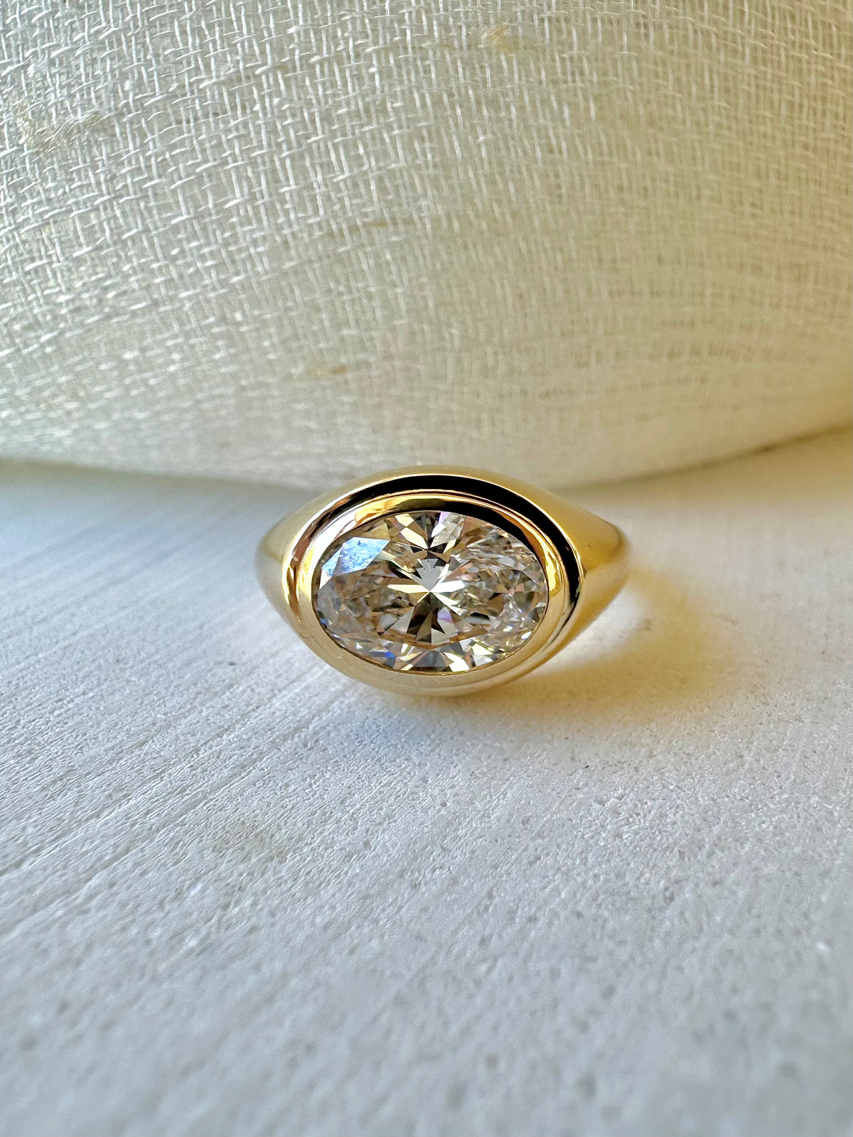 Oval lab diamond signet ring in 18K gold, third view