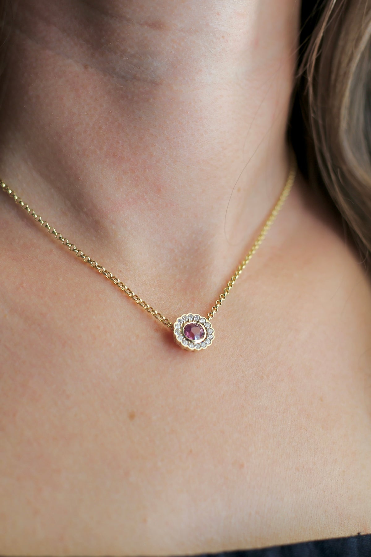 Oval halo pendant in 14K yellow gold with a bezel set center gemstone and lab diamond halo | Yasmin Nabulsi Fine Jewelry