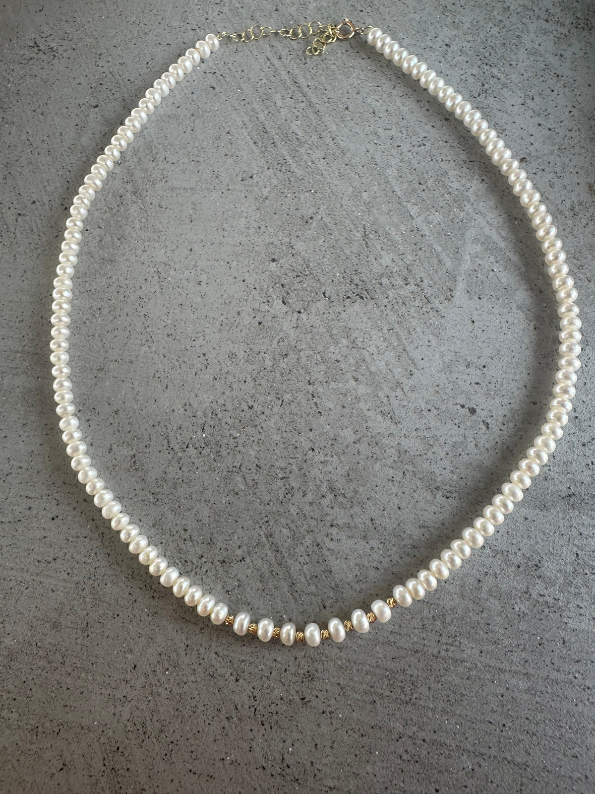 Dainty pearl necklace with a 2 inch chain extender for adjustable length