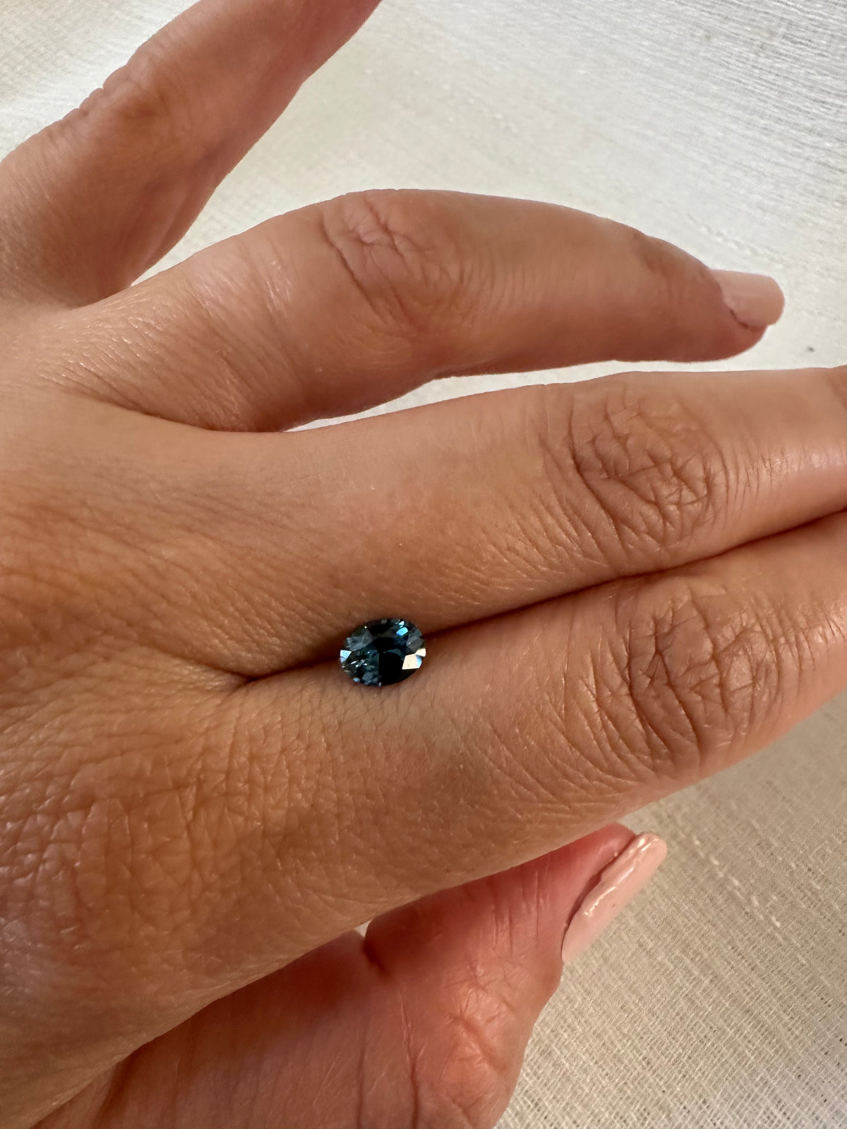 Teal sapphire 0.73ct mixed oval, another angle