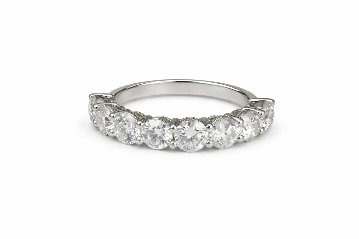 Shared prong setting with 8 round lab diamonds on a low profile band