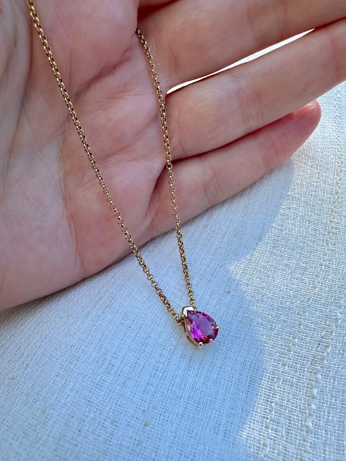 Teardrop slide-through pendant in 18K gold with a prong set gemstone | Yasmin Nabulsi Fine Jewelry