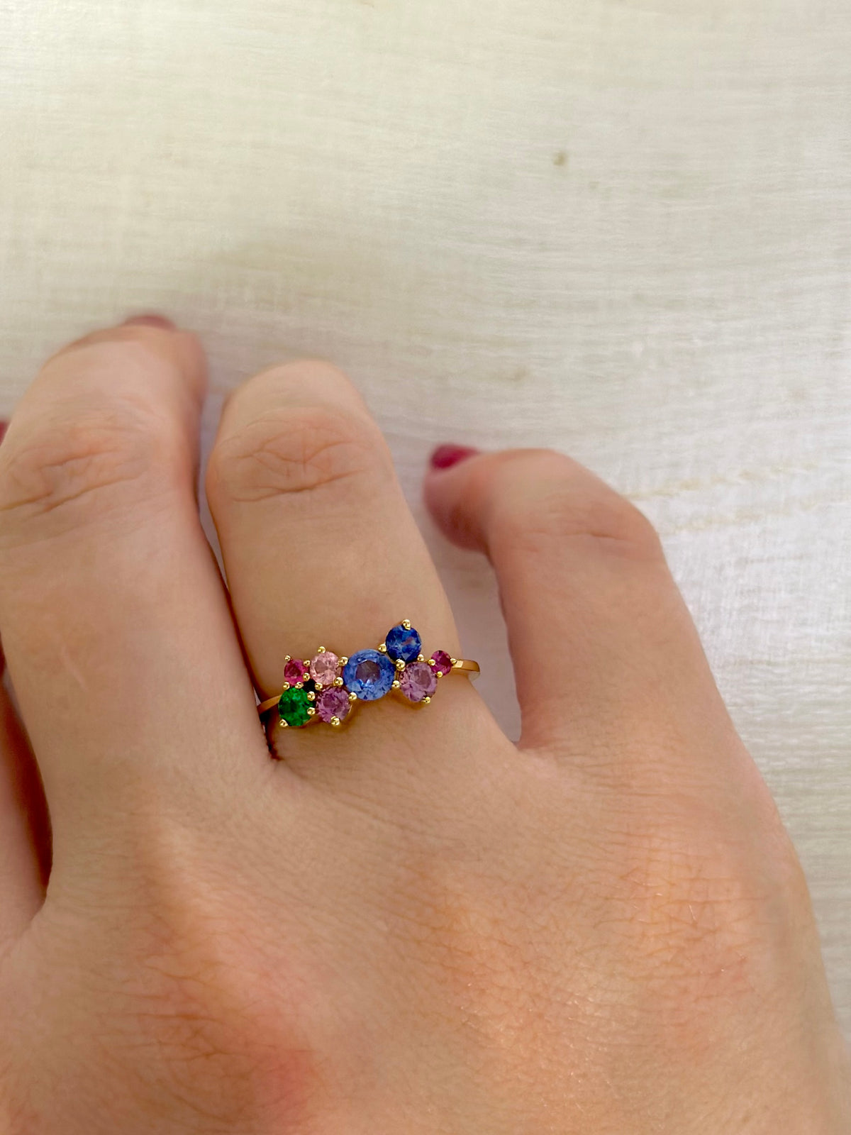 18K gold cluster ring with multicolor natural sapphires and a natural emerald | Yasmin Nabulsi Fine Jewelry