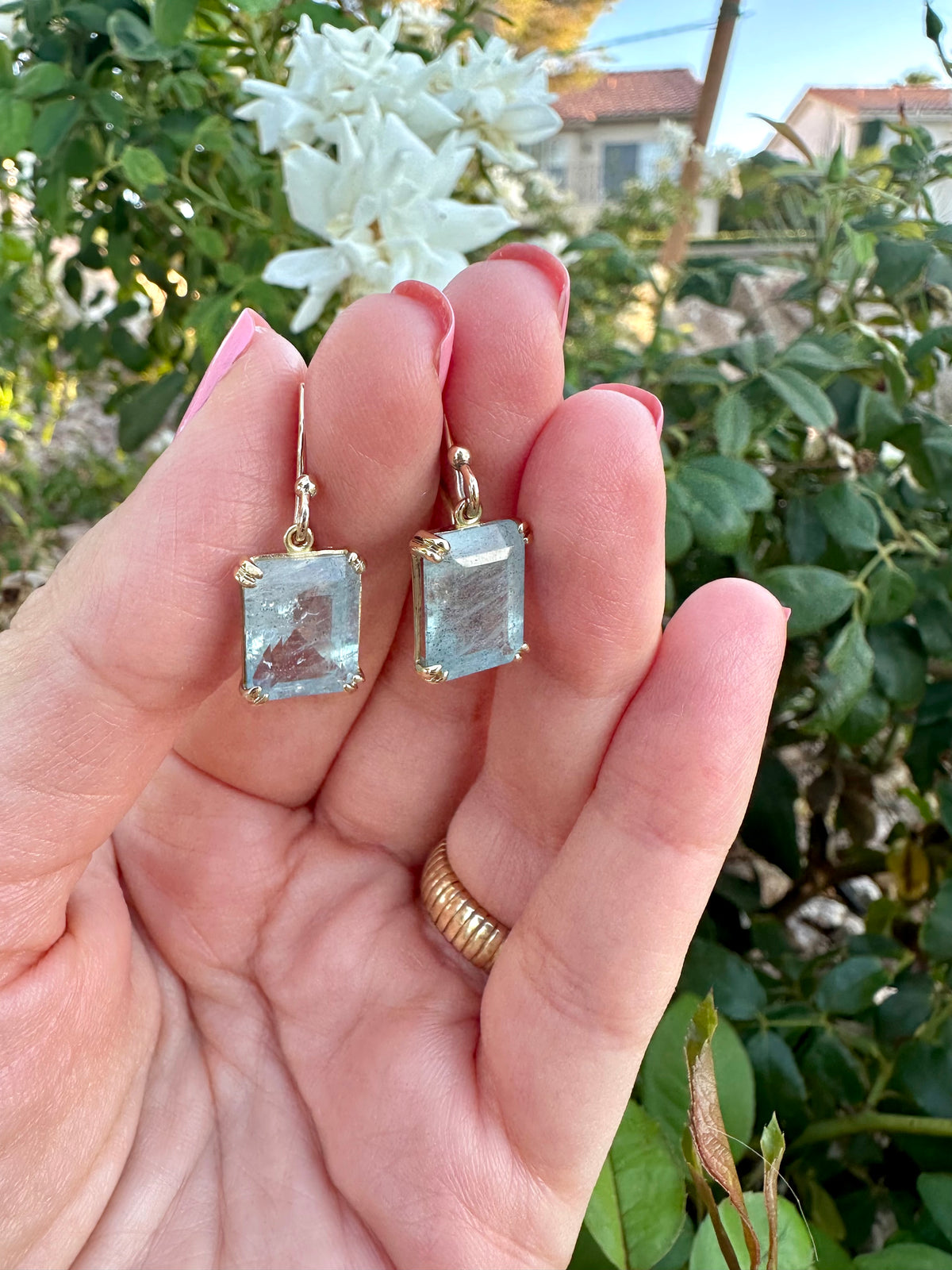 18K yellow gold drop earrings with a light green aquamarine and delicate french hooks