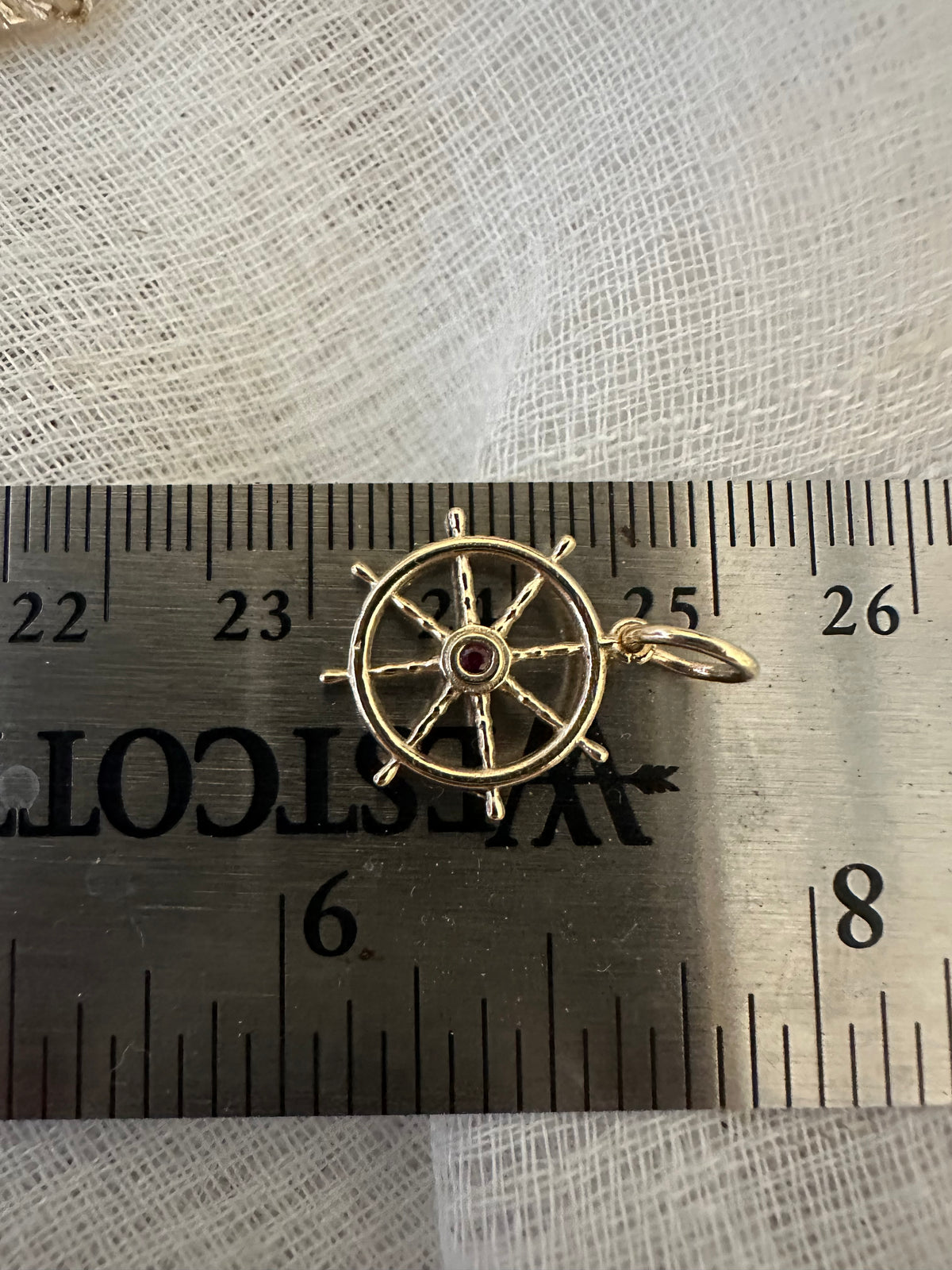 Ruby set anchor wheel charm in 14K gold, 15mm in size