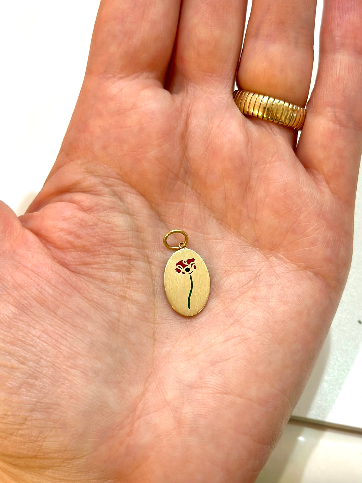 Poppy flower charm designed to hang from any chain in the chain collection