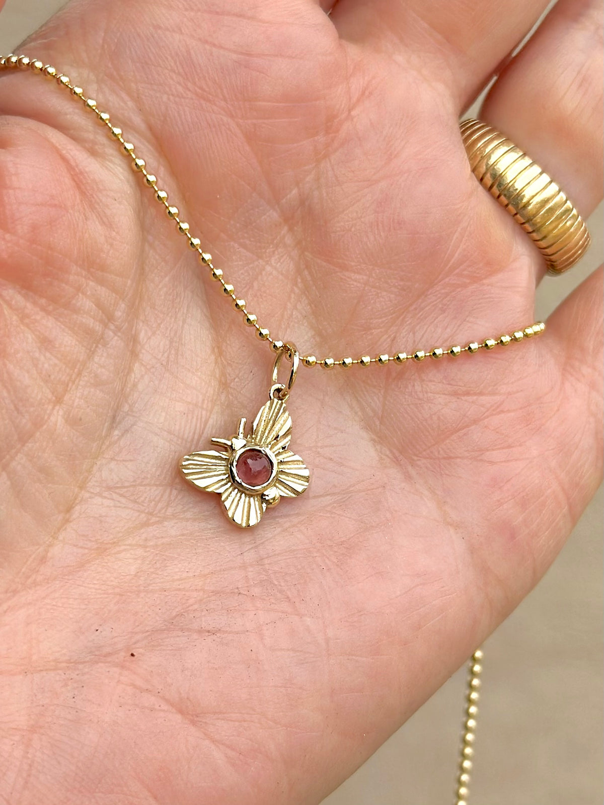 Butterfly charm with a round pink tourmaline, in 14K or 18K gold