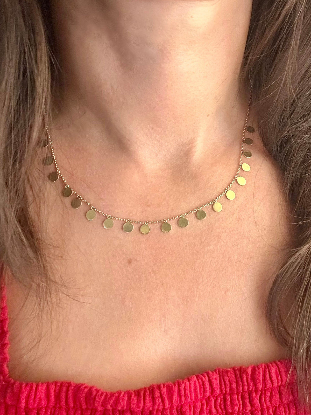 18K gold disc necklace with 19 round 5mm discs, shown in 16 or 17 inch lengths