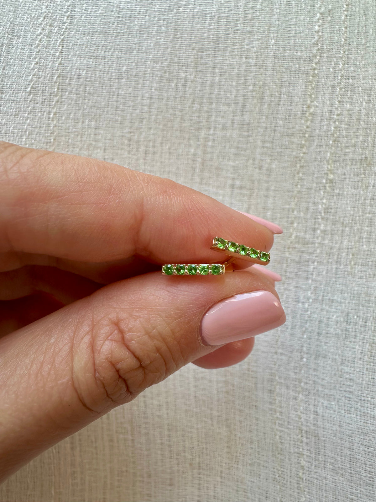 Tsavorite stud earrings in 18K gold, sold as a pair