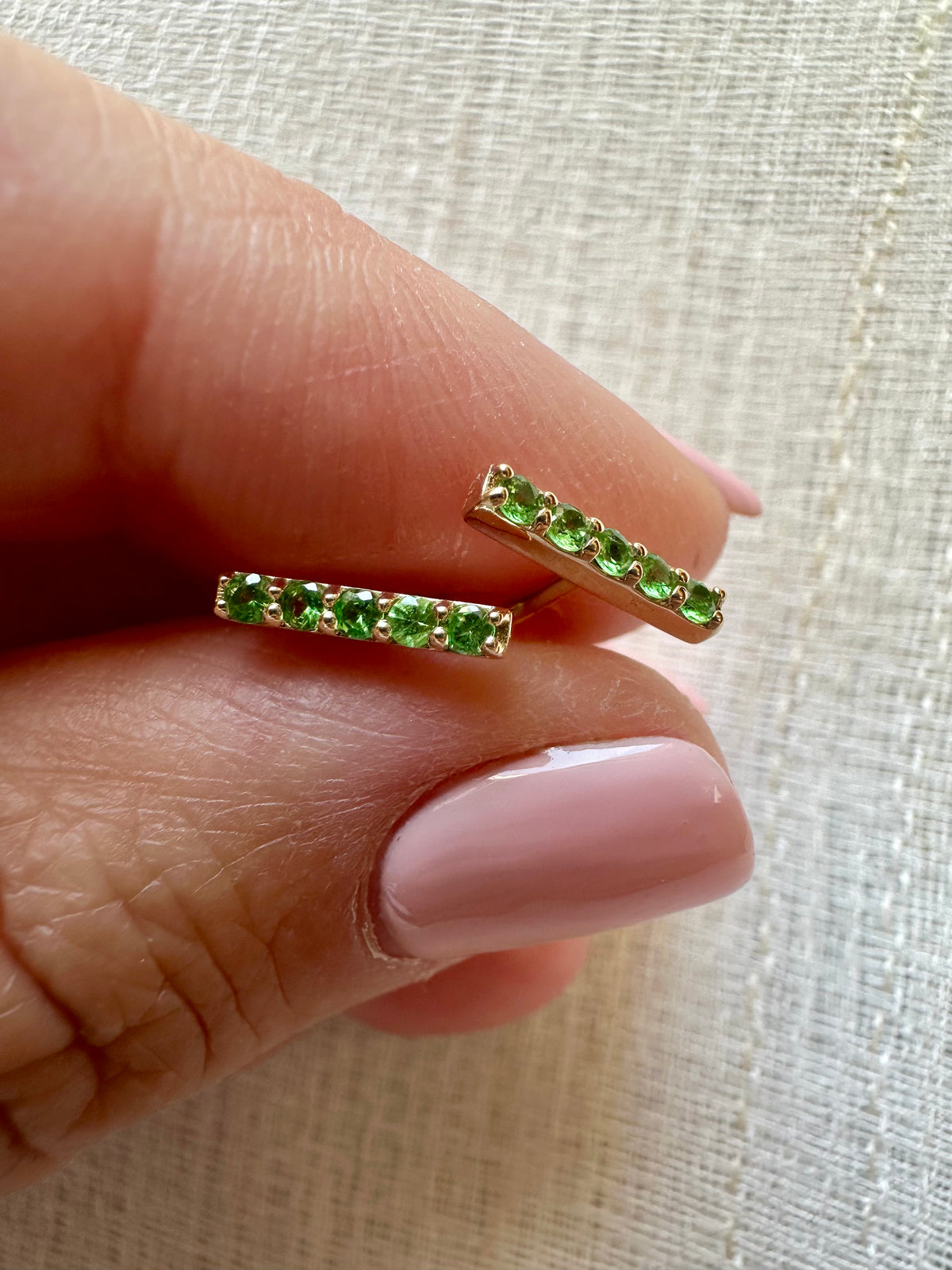 Tsavorite bar stud earrings with a linear design, sold as a pair