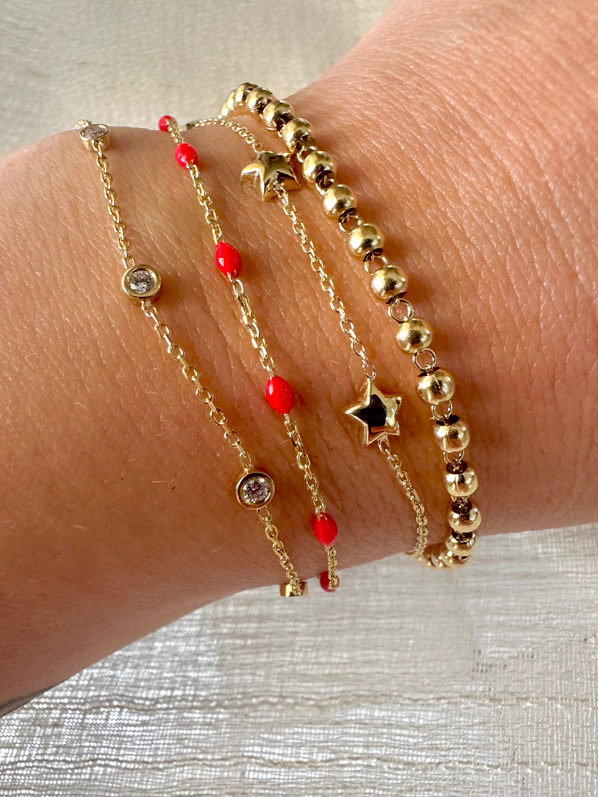 18K gold stars bracelet with spring clasp and puffy star charms