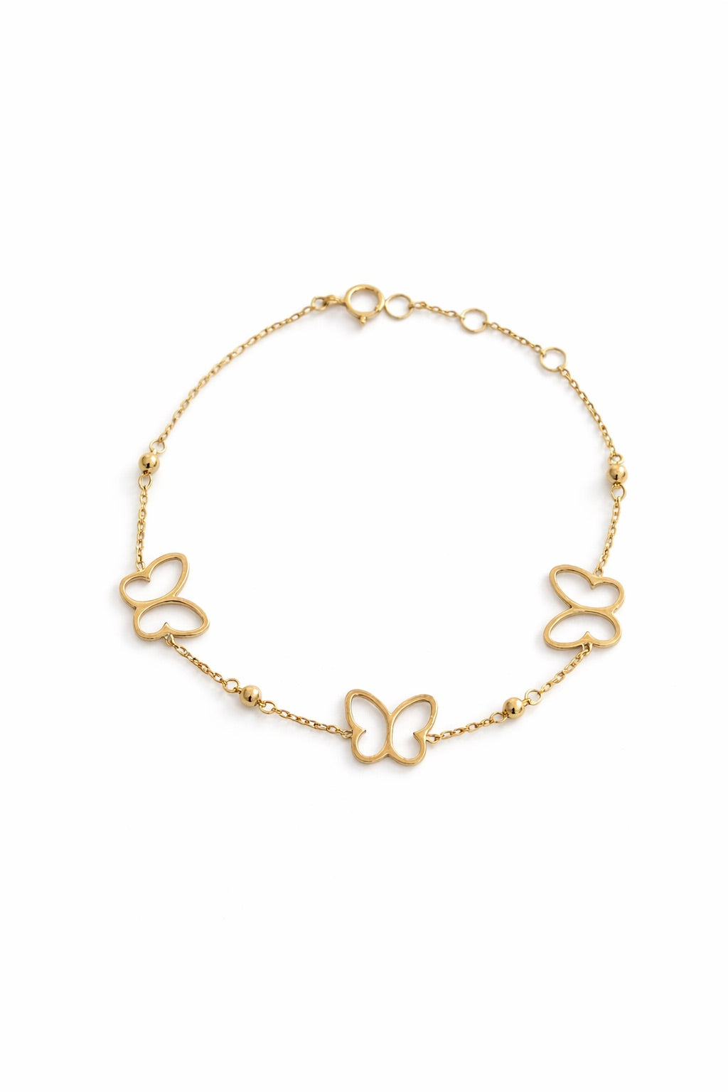 Open butterfly charm on a delicate 18K gold chain