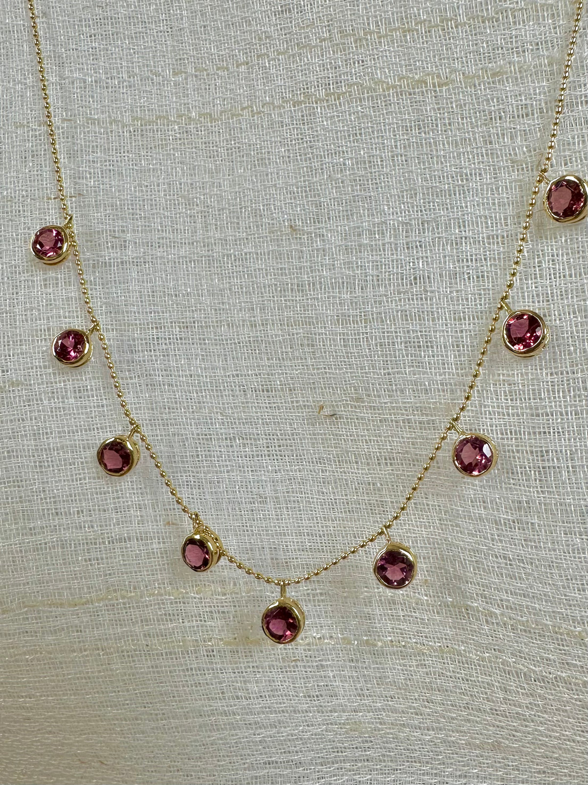 Handcrafted natural pink tourmaline drops set in 18K gold bezels