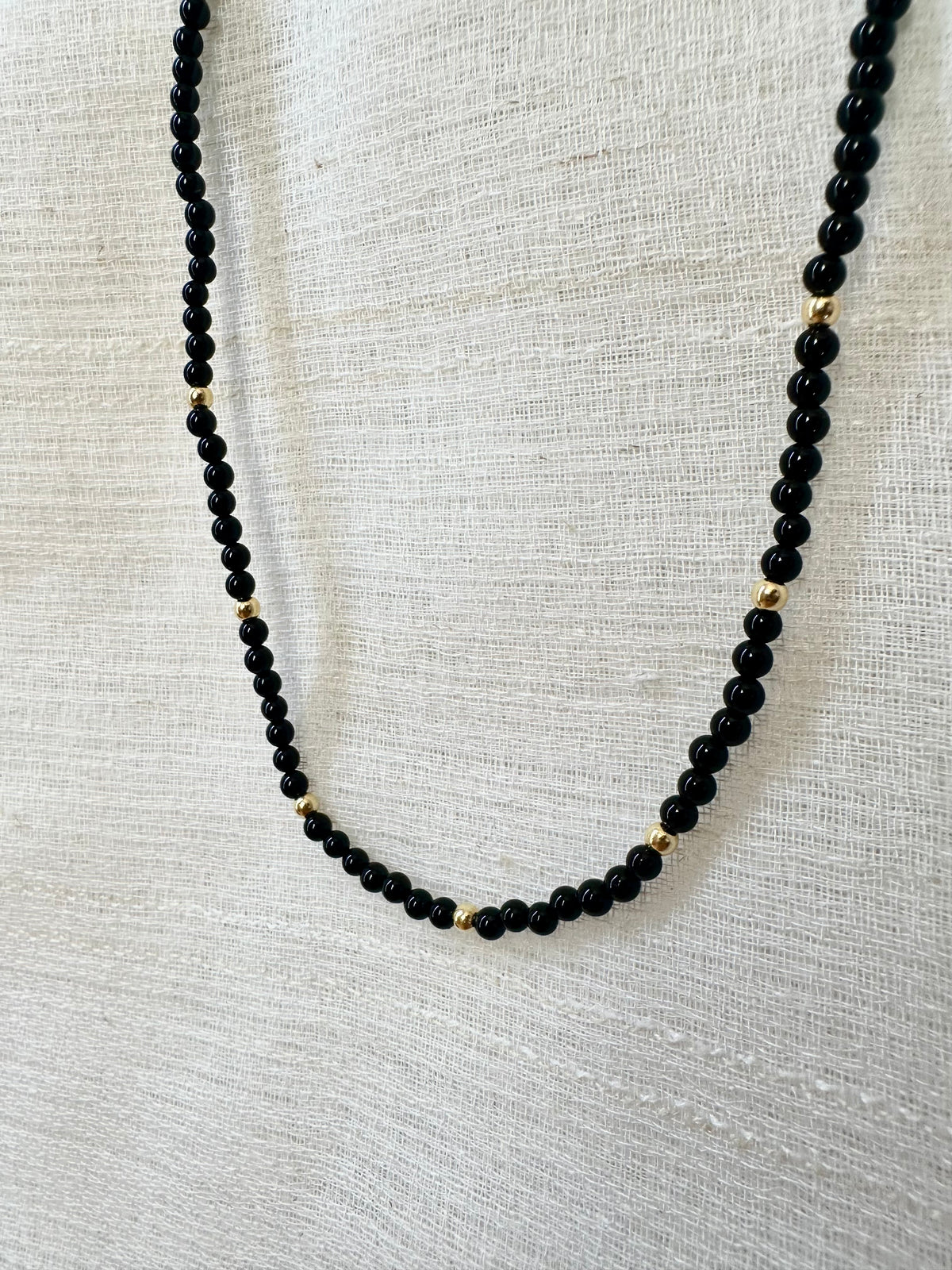 Black onyx beaded choker necklace with 18K gold beads and findings | Yasmin Nabulsi Fine Jewelry