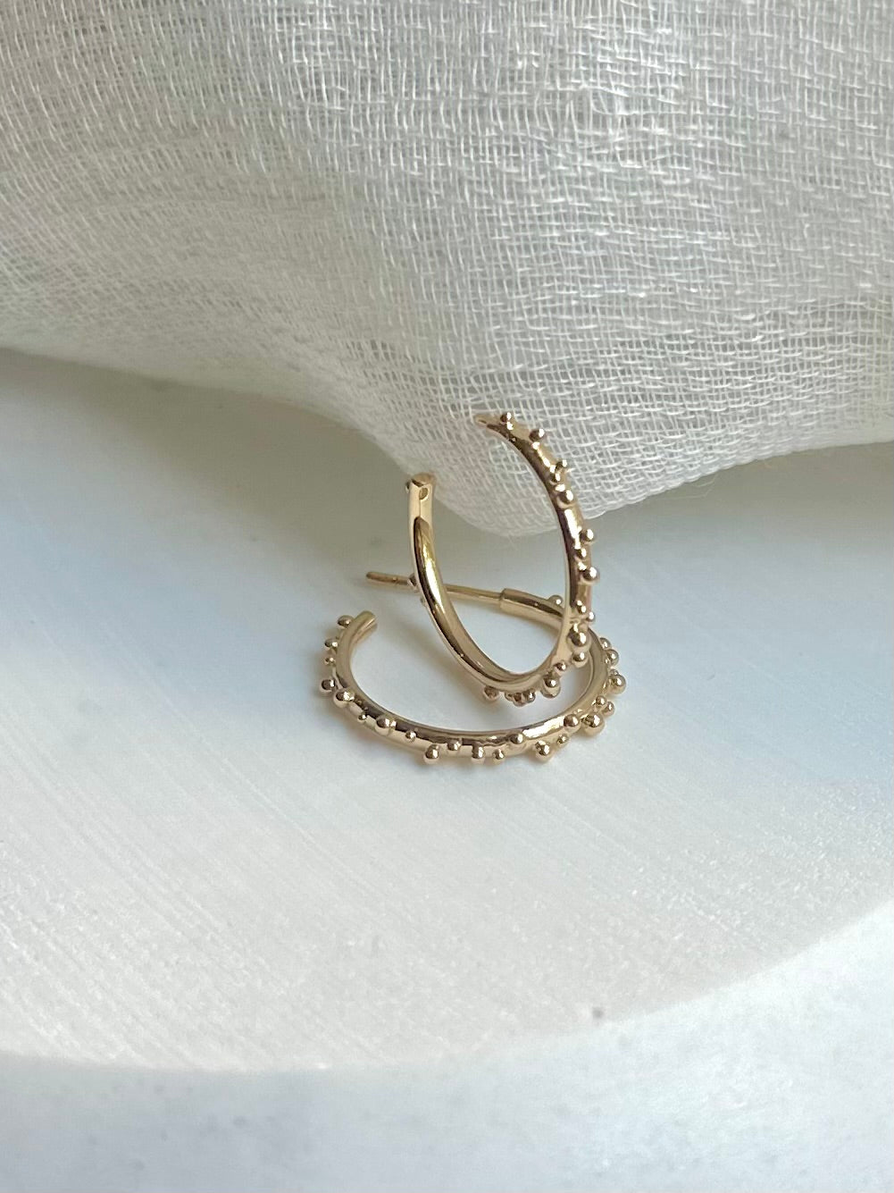 Polished gold hoop with a solid 2mm round wire