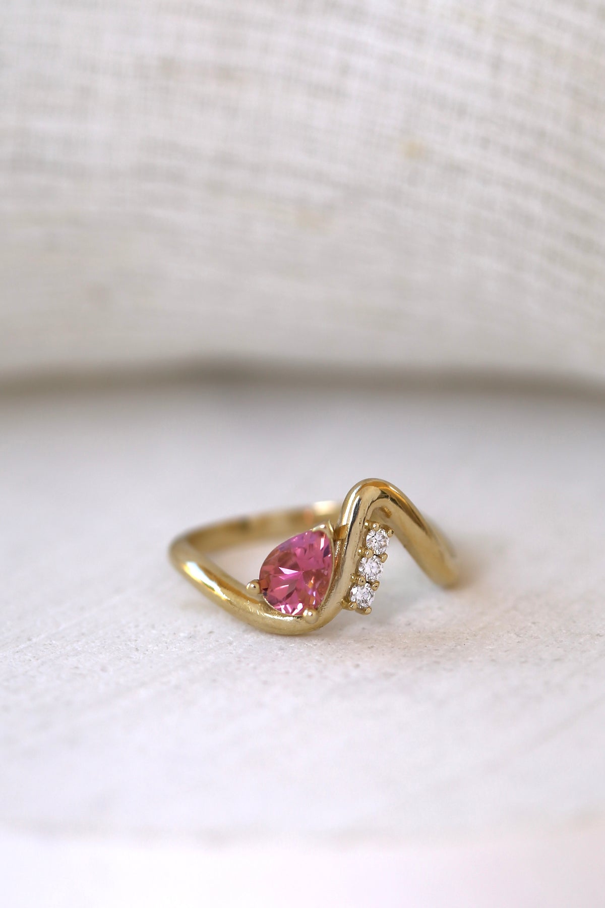 Wave ring with a pear shaped center stone, a second view