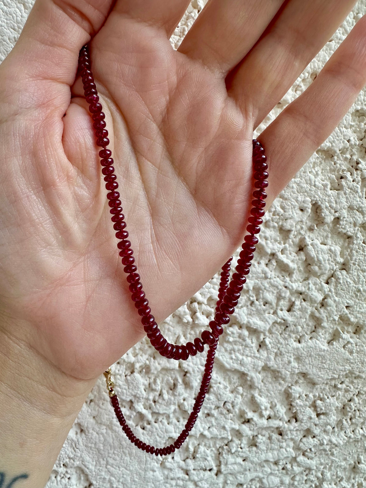 Graduated natural ruby beads that grow from tiny at the back to 5mm at the front
