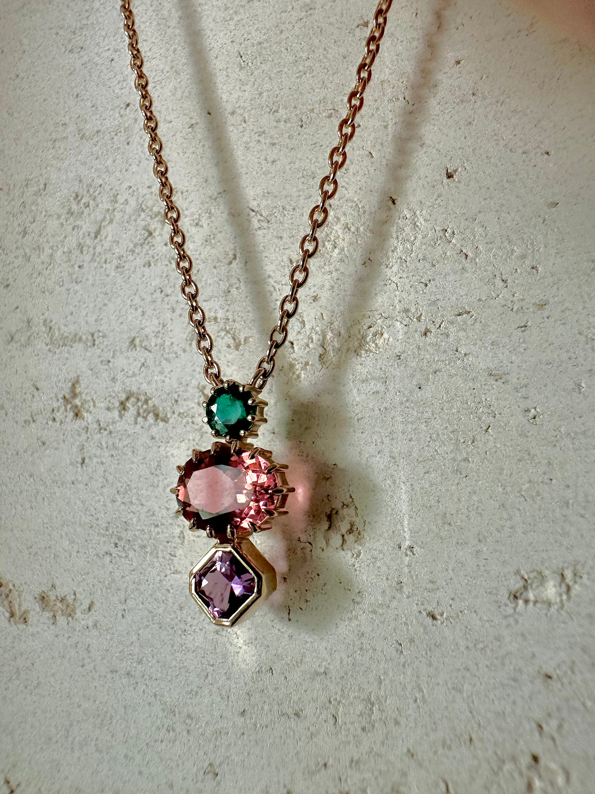 Three stones necklace with each gem in a different cut, in 18K solid gold