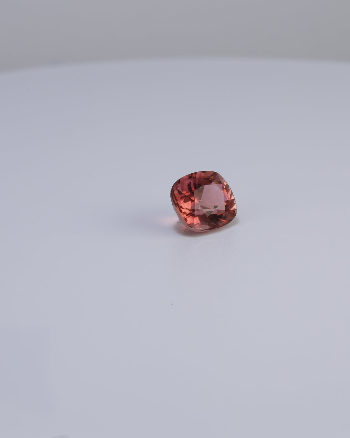 Pinkish peach tourmaline, a 1.42 carat cushion cut stone