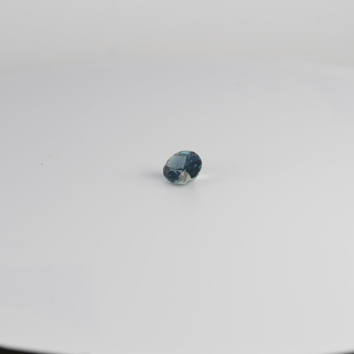 Teal sapphire, mixed oval cut, 6.3 by 4.8 mm