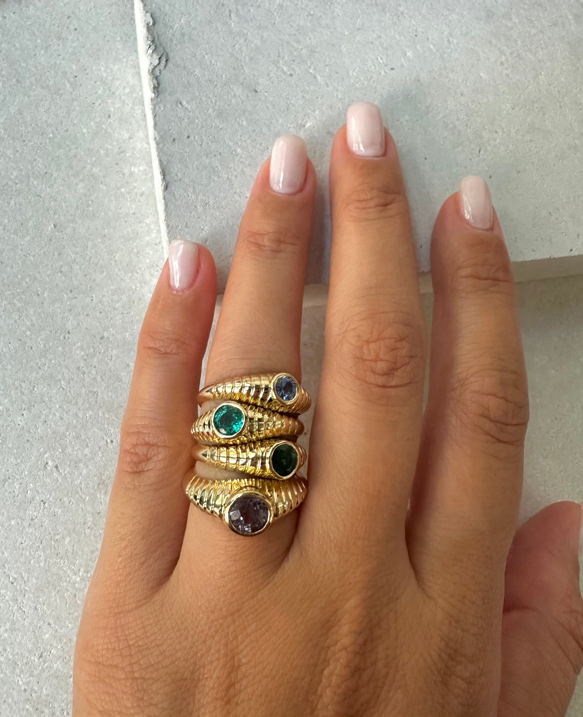 Natural emerald ring with a vintage inspired look and a modern ribbed band