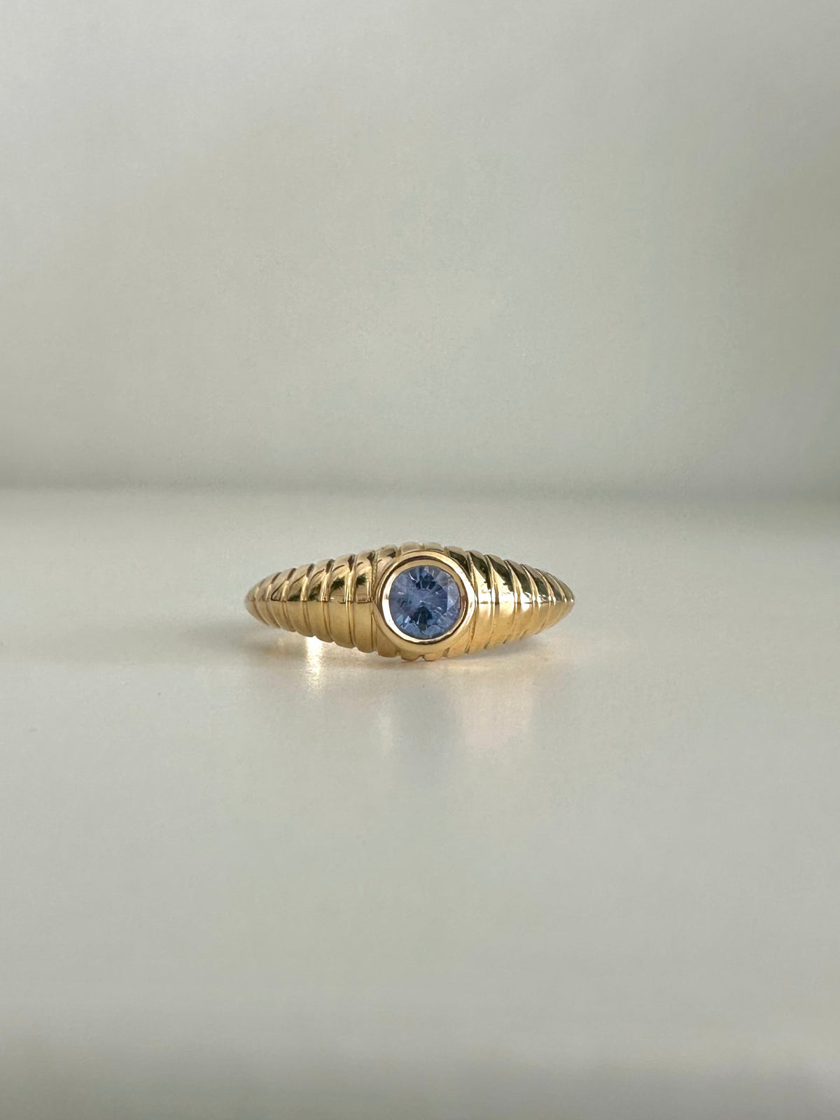 Vintage inspired blue sapphire ring with a 4 to 4.3mm bezel set heated sapphire