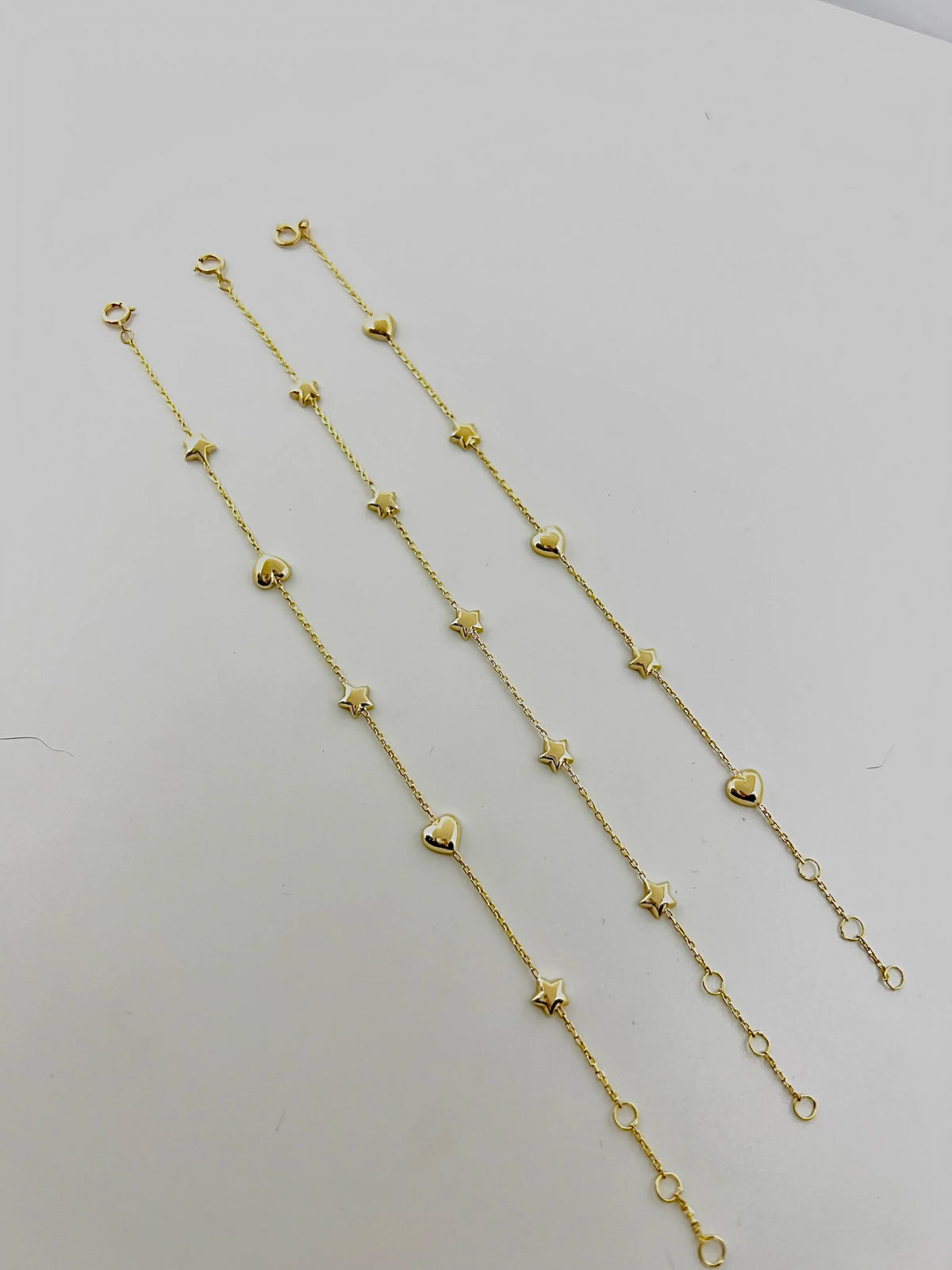 Gold chain bracelet with puffy star charms, optional stars and hearts