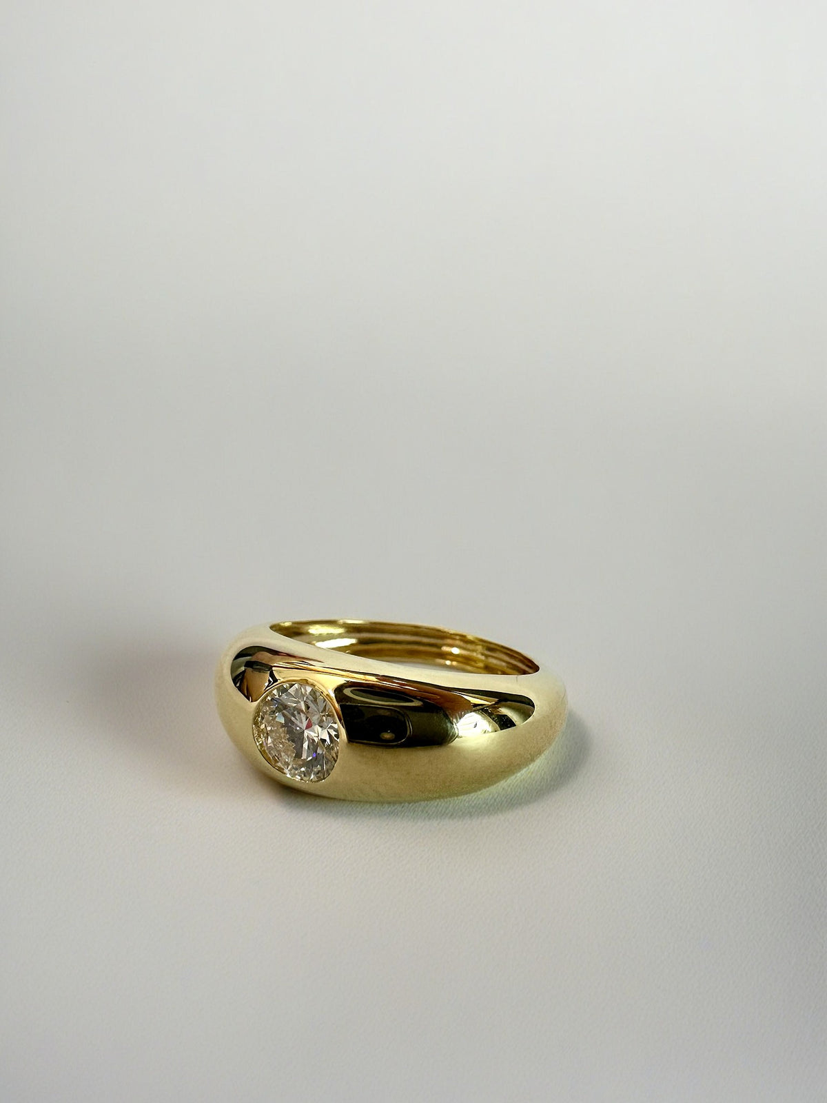 Gold dome ring with a lab grown diamond, custom sized