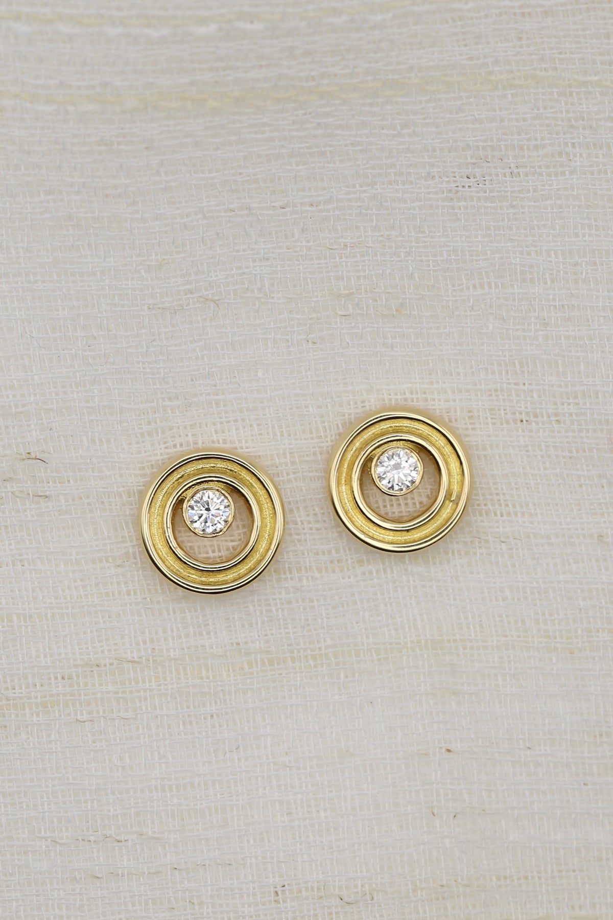Round lab diamond stud earrings in 18K gold, about 8mm in diameter | Yasmin Nabulsi Fine Jewelry