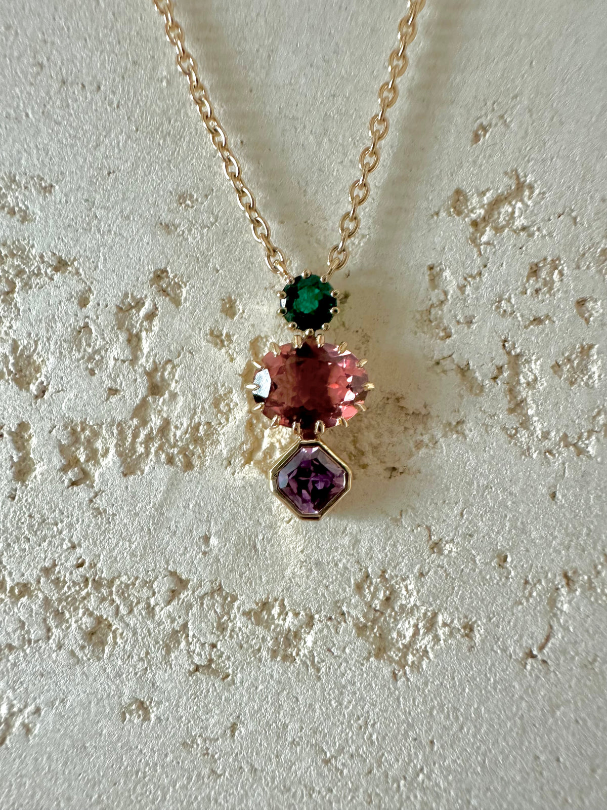 Multi stone gold necklace with emerald, tourmaline and sapphire