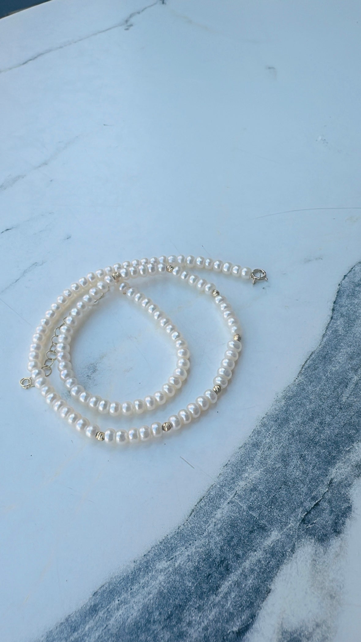 Pearl necklace with 2.8 to 3.5mm freshwater pearls on nylon wire