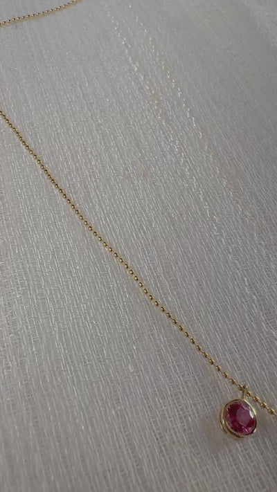 Handcrafted 18k Pink Tourmaline Station Necklace featuring nine pink tourmalines bezel set and dangling from a dainty ball chain necklace. Perfect as October Birthstone gift | Ella Creations Jewelry