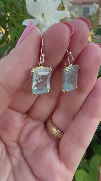 Elegant Drop Aquamarine Earrings handcrafted in 18 karat solid gold featuring emerald cut light green aquamarine stones in an open back prong setting and delicate french hooks. | Ella Creations Jewelry