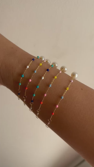 stunning Pearl Bracelet Delicately crafted in a 18 karat gold chain, and featuring a series of enamel beads in a delightful array of colors | Ella Creations Jewelry