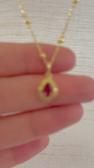 Pink Tourmaline pendant, set into a custom, two-tiered 18k gold bezel that matches the stone's pear shape. The pendant has a solid gold back with an opening behind the stone to allow the light to best reflect the stone shade and sparkle.