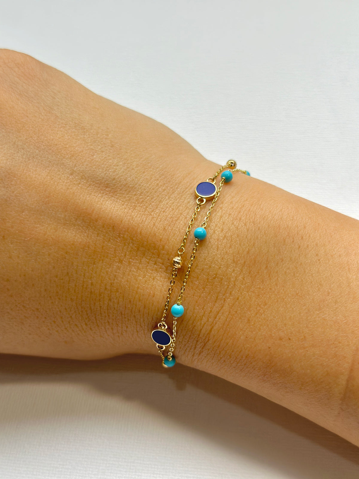 Small gold chain bracelet with turquoise beads