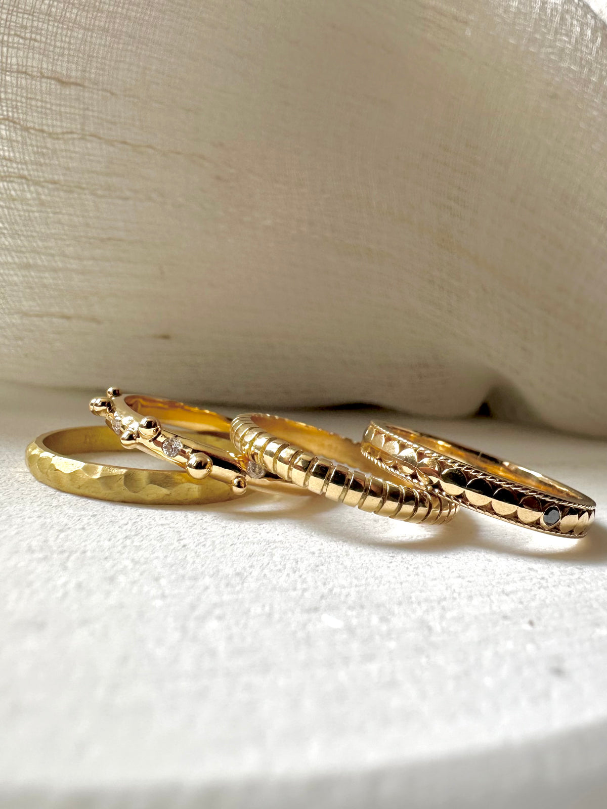 Textured gold stacking ring with a 2.4mm band