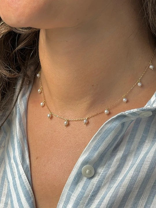 Station pearl necklace with 3 to 3.5mm freshwater pearls in 18K gold | Yasmin Nabulsi Fine Jewelry