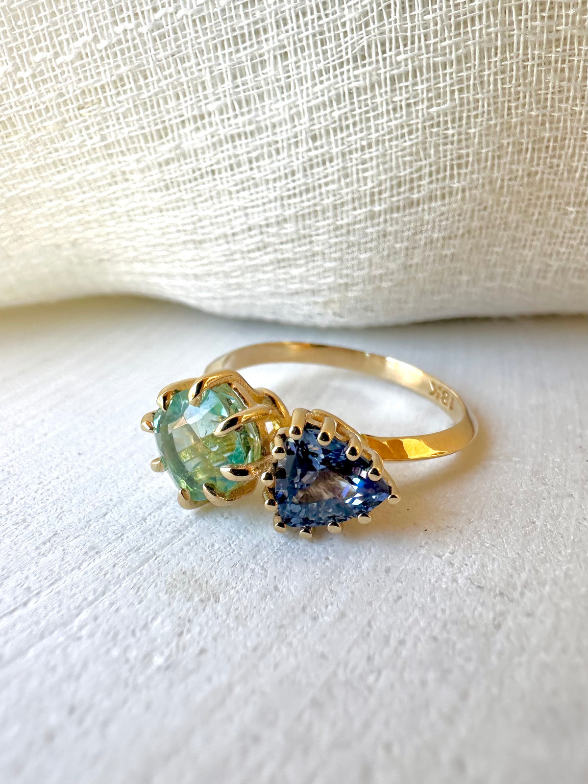 Toi et Moi ring with a cushion-cut green tourmaline and triangular blue sapphire in 18K gold | Yasmin Nabulsi Fine Jewelry