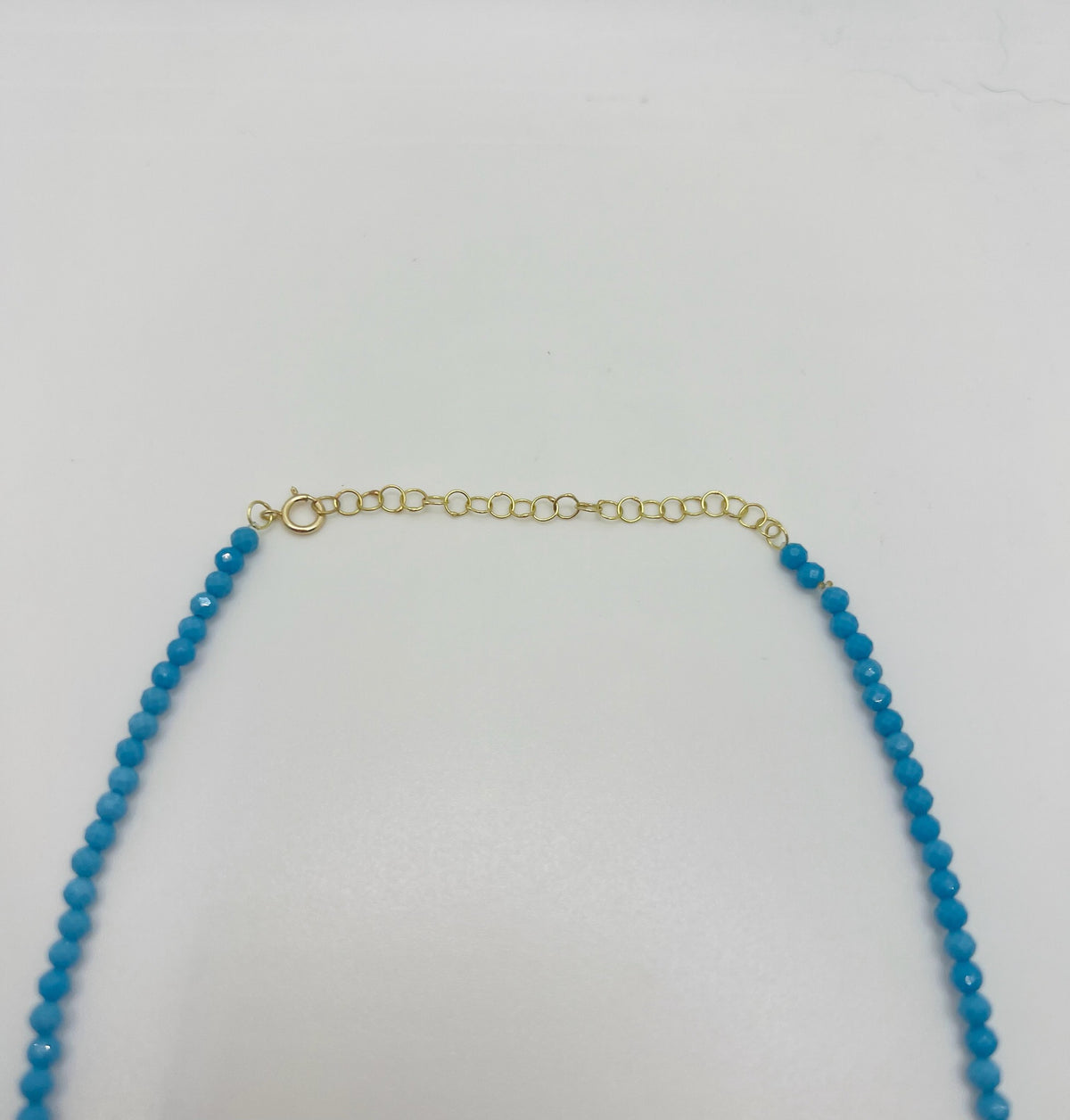 Turquoise beaded choker with a chain extender for an adjustable 14 to 16 inch length